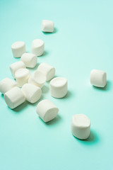 Сlose-up of marshmallow on turquoise background