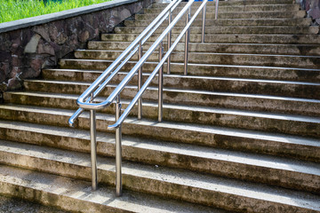 chrome railings on concrete and granite steps