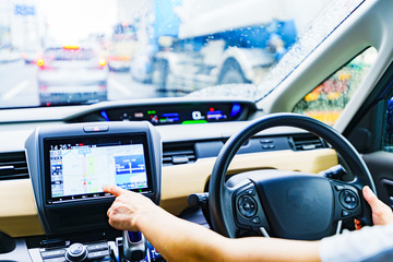 Japanese lady driver search the route by using the touch panel