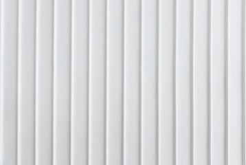 closeup of simplicity white wall with vertical line pattern panel background texture.