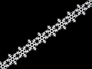 White laces snowflake on black background. Christmas and New year concept