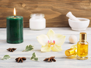 Still life from natural aromatherapy and spa ingredients on a white wooden background
