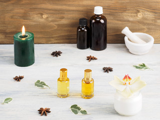 Still life from natural aromatherapy and spa ingredients on a white wooden background