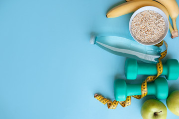 Fitness and diet concept on color background with copy space