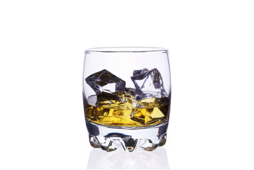 A glass of whiskey with ice cubes on a white background.