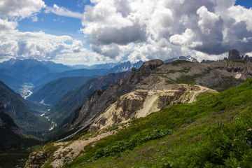 clouds over mountain trail in Dolomites