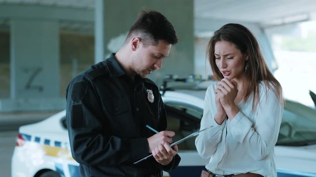 Afraid woman talk with policeman about an incident arrest criminal enforcement burglar man officer black bad robbery business busted illegal slow motion