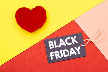 small red heart  and tag with black friday concept isolated on colorful background