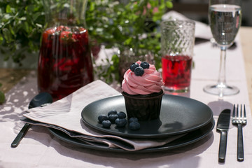 cupcake with berry in the table