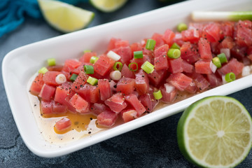 Tuna ceviche or raw tuna fillet marinated in a lime juice, selective focus, close-up