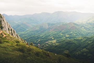 Landscape view of cloudy mountains in Asturias, Spain during summer. 