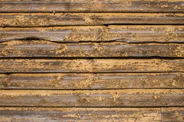 Wooden background of peeling cracked surface. Abstract pattern in rustic style