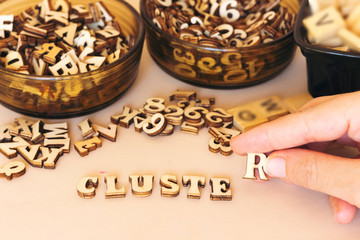 forming cluster concept from wooden letters