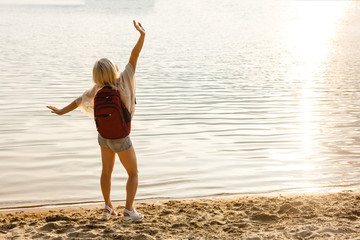 Close-up portrait of hiking woman relaxing at sea