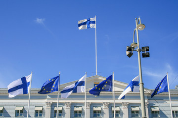 Flags of Europe and Finland waving together on the Presidential Palace in Helsinki, European Union