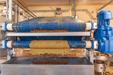 Modern Machine squeezes apples and apple pomace remain as press residues