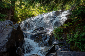 Natural waterfall in the Alpine Lakes Wilderness. Central Cascade Mountain Range, Washington State, July 2019.