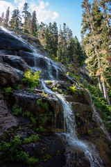 Natural waterfall in the Alpine Lakes Wilderness. Central Cascade Mountain Range, Washington State, July 2019.