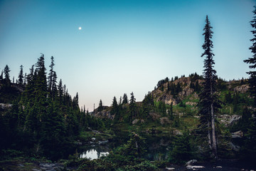 Pre-dawn sunrise over Lila Lake in the Alpine Lakes Wilderness. Central Cascade Mountain Range,...