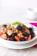 Fresh fruit salad with granola and yoghurt