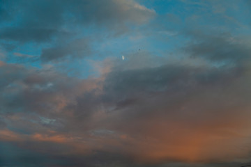 Evening colorful cloudy sky in the summer sunset
