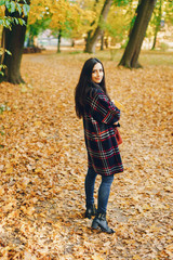 stylish girl exploring the city and park in the autumn