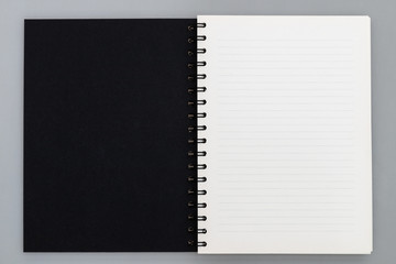 Business copy space, luxury spiral notebook with black cover, top view