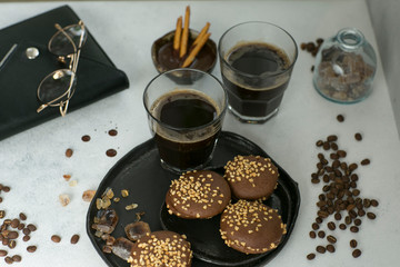 cup of coffee with cookies and sugar