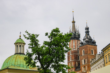 Fototapeta na wymiar Krakow, Poland - May 21, 2019: Spiers of churches and churches in the old part of Krakow.