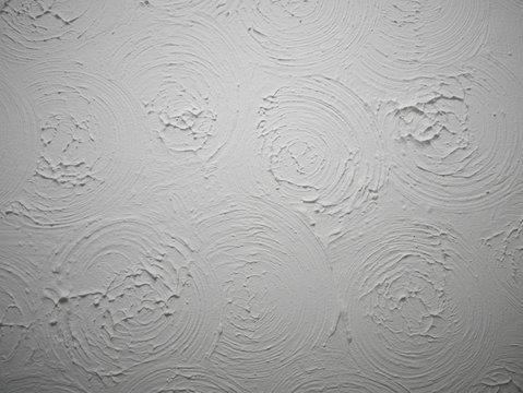 Swirly patterned ceiling plaster pattern known as Artex was common in the 80s.