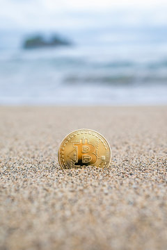 Bitcoin on a sandy beach