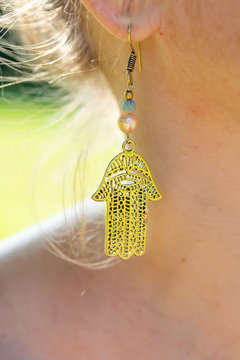 Woman outdoor wearing beautiful boho style earring
