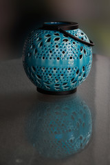 teal blue lantern waiting to light up the night