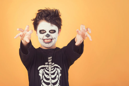 Happy Halloween. funny child in a skeleton costume of halloween
