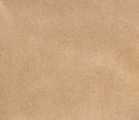 Fototapeta na wymiar Detailed textured smooth brown kraft paper background.