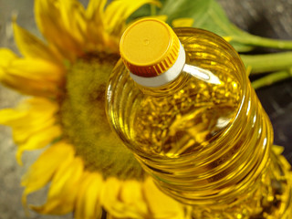  bottle with sunflower oil close-up on a background of sunflower