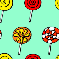 Colorful lollipops on green background in flat style design. Seamless background with cute candy.