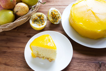 Passion fruit cake on wood background.