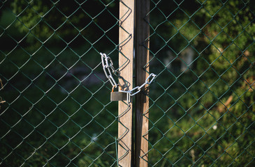 Closed gate with a chain and a padlock