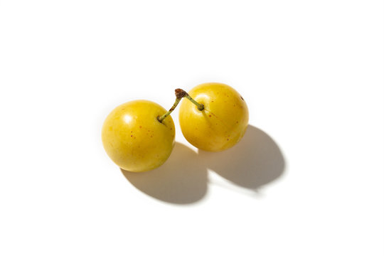 Yellow plum mirabelle fruit isolated on white background