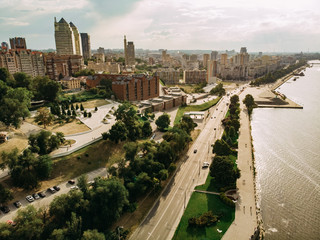 Aerial photography of a cityscape with a river, a road and a skyscrapers.