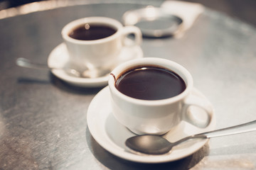 Cups with hot chocolate - high-calorie dessert - selective focus