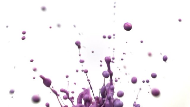 Close up colorful splashing paint in super slow motion.
