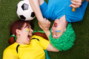 Soccer fans support their team and celebrate goal