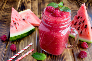 Smoothies from watermelon and raspberries  on the bown  wooden background