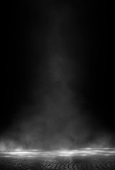 Wet asphalt, reflection of neon lights, a searchlight, smoke. Abstract light in a dark empty street with smoke, smog. Dark background scene of empty street, night view, night city.