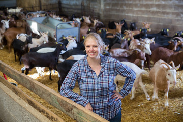 Successful woman farmer in the goat house