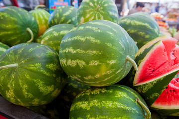 Pile Of Fresh Tasty Summer Fruit Watermelons On Local Green Market