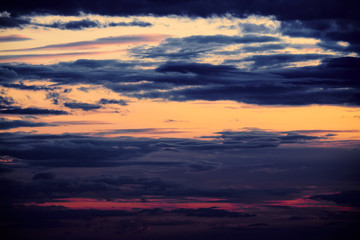 Beautiful sunset - dark sky with clouds and sunlight