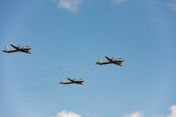 Dress rehearsal of parade July 25, 2019 in St. Petersburg. Day of Navy in Russia. Air part of parade. Military aircraft in sky. Airplane on blue background. Group of planes